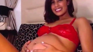 Beautiful pregnant babe feeling her baby kicking