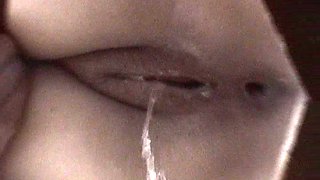 Slender babe with nice face is peeing sexy