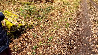 Slapping Her Naked Vagina on a Woodpile