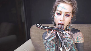 Anuskatzz grabs her cold, stainless steel toy and slides it deep into her tight ass