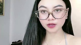 Beautiful Asian Woman Shows Off Cleavage