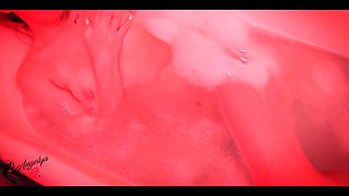 A Girl with an Excellent Figure Has Fun in the Bathroom with a Dildo