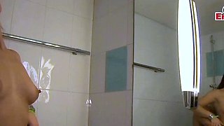 Brunette woman lets herself be fucked in the shower