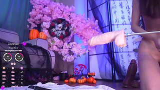 Amateur Asian babe enjoys playing with her fat fuck machine on webcam