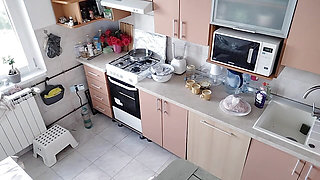 Hot amateur couple having fun in the kitchen.