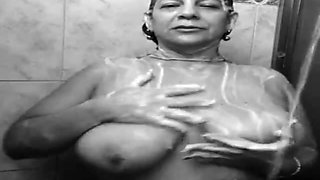 busty mature aunty bathing