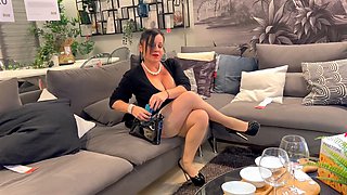 Busty mature cougar Erika Preziosi shows off nylons and stilettos in the furniture store