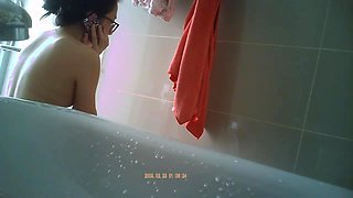 Innocent asian spy in a bathroom