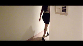 MILF in Stockings and Heels Walks Through the Corridors of a Hotel