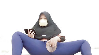 Indonesian hijab aunt wearing cucumber