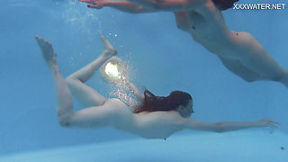 Girlfriends enjoy swimming naked together