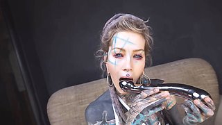 Anuskatzz grabs her cold, stainless steel toy and slides it deep into her tight ass