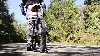 Young man playing with his bike with dildo in his ass