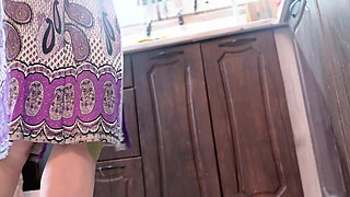 A milf prepares a salad in an open robe without panties, flashing her tits and pussy.