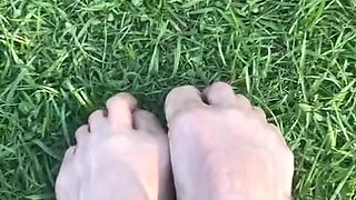 Melove Showing Her Sexy Small Feet on Green Grass