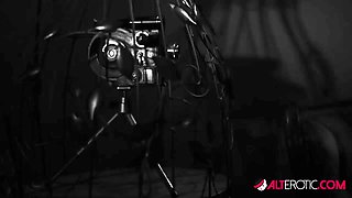 Darenzia Teases in a Black Latex Corset - AltErotic