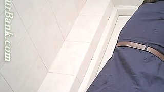 Lovely white teen chick shows her booty upskirt in the toilet