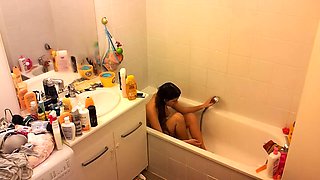 Spy camera in the bathroom captures sexy stepmom naked