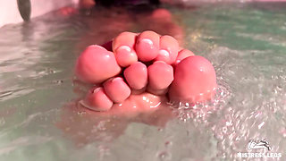 Mistress Teases in the Jacuzzi with Bare Wrinkled Feet and Delicious Ass