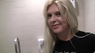 Sweet blonde girl is giving a hot blowjob in the toilet