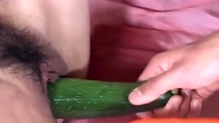 Naked asian teen gets hairy twat nailed with vegetables