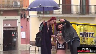 Lezdom redhead MILF shows teen slave outdoor in public