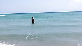 On a nudist beach I meet a guy masturbating and I help him