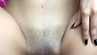 Real Indian Girl Playing with Herself on the Bed While Whispering Dirty Hindi Words Throughout the Video