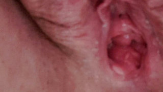 Pissing in close up with open pussy