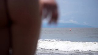 Sexy Latina MILF in bikini posing seductively on the beach