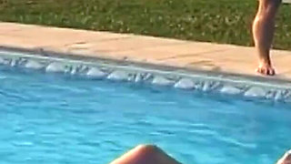Busty blondie gets cum in mouth while fucking by the swimming pool