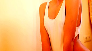 Small titted brunette Sharron with glasses masturbates