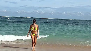 Teasing on the Beach in Micro Bikini on the Sand