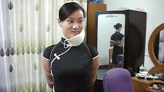 Two Chinese Girls Tied, One Wearing Cloth Mask