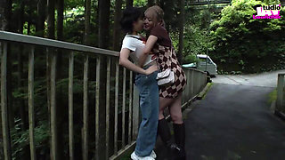 A Blonde and a Dark-haired Beauty Share Wild Passion Beneath the Open Sky -b