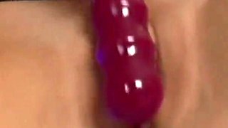 Kara Novak fucks her holes herself with a glass dildo