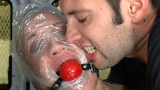 Tied up blonde is face-fucked by four kinky fellows