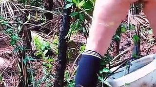Peeing on a Toilet in the Woods