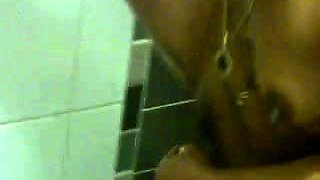 Naughty amateur wife shaves her hairy pussy in the shower