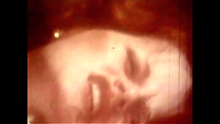 Vintage Redhead with Huge Boobs and Black Stockings Has Solo Sex in Her Bed