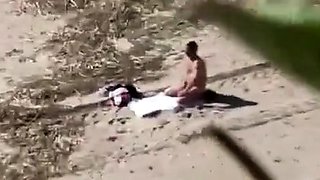 A Voyeur Films A Couple On Beach