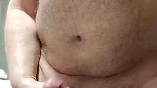 Chubby bear probing his cock