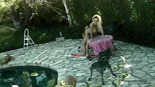 Blonde doll enjoys outdoor lez action with horny slut