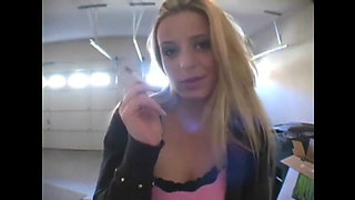 Blonde bitch smoking a cigarette in a close up video