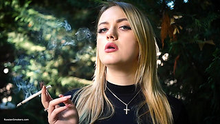 Hot Blonde Babe Smoking One Black Cigarettes in Nature