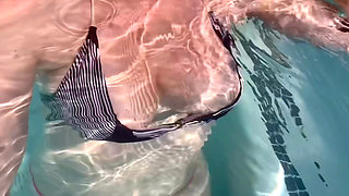 Artemisia Love flashing her juicy big tits underwater for you wearing a sexy bikini