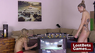 Two best friends navigate this comedic Strip Foosball game