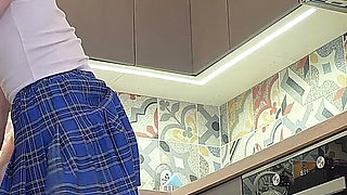 The Juggler Girl Is Here in a Long School Type Uniform Skirt to Flash Her Panties Under Her Miniskirt in the Kitchen