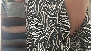 in the bathroom showing what's under her dress to her young lover on camera