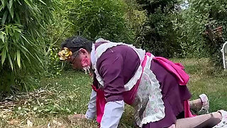 In gardener's outfit, peeing on all fours like a dog